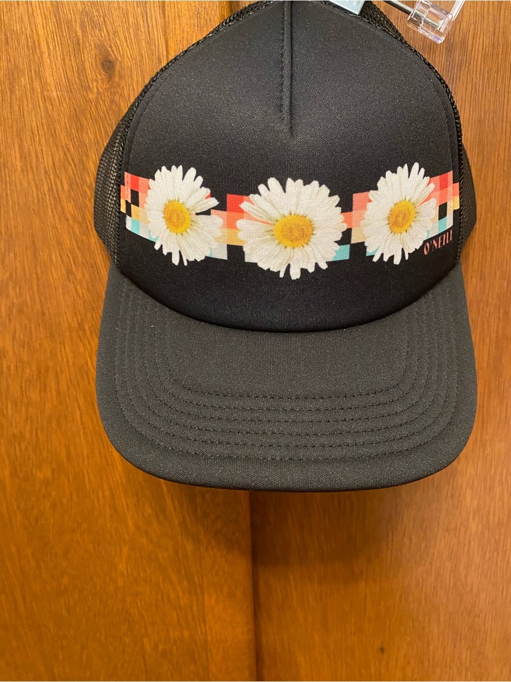 O'Neill Black Trucker Hat with White Daisy Graphic